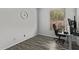 This office features gray wood flooring and a view of a blossoming shrub at 15691 N 104Th Pl, Scottsdale, AZ 85255