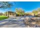 Outdoor seating with a table, grill, and shade, offering a perfect spot for community gatherings at 15691 N 104Th Pl, Scottsdale, AZ 85255