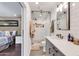 The renovated bathroom features a glass shower door and subway tiles in the tiled shower at 1607 E Gable Ave, Mesa, AZ 85204