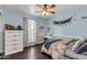 Charming bedroom with light blue walls, stylish decor, and a comfortable inviting atmosphere at 1607 E Gable Ave, Mesa, AZ 85204