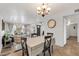 Bright dining area with a decorative light fixture is located adjacent to living area at 1607 E Gable Ave, Mesa, AZ 85204