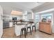 Bright kitchen boasts stainless steel appliances, white cabinets, and tile flooring at 1607 E Gable Ave, Mesa, AZ 85204
