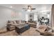 Spacious living room adjacent to modern kitchen with an open floor plan at 1607 E Gable Ave, Mesa, AZ 85204