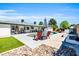 Inviting backyard pool area featuring a refreshing pool, lounge chairs, and lush landscaping at 1607 E Gable Ave, Mesa, AZ 85204