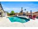 Inviting pool surrounded by a spacious patio, outdoor furniture, and a built-in grill at 1607 E Gable Ave, Mesa, AZ 85204