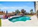 Inviting pool surrounded by a spacious patio, outdoor furniture, and a built-in grill at 1607 E Gable Ave, Mesa, AZ 85204