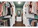Organized walk-in closet with custom shelving and ample storage space for clothes and accessories at 1607 E Gable Ave, Mesa, AZ 85204