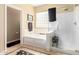 Bright bathroom with a soaking tub, and a glass enclosed shower, perfect for relaxation at 17613 W Gelding Dr, Surprise, AZ 85388