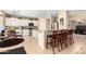 Kitchen with white cabinets, granite counters, stainless steel appliances and a breakfast nook area at 17613 W Gelding Dr, Surprise, AZ 85388
