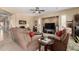 Comfortable living room showcasing ample seating, a ceiling fan, and a built-in media center at 17613 W Gelding Dr, Surprise, AZ 85388