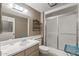 Neutral bathroom featuring a tub, shower, sink, toilet, and ample lighting at 19046 N Signal Butte Cir, Sun City, AZ 85373