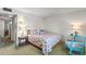 Comfortable bedroom with a bed, blue rocking chair, accent lighting, and relaxing decor at 19046 N Signal Butte Cir, Sun City, AZ 85373