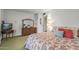 Spacious bedroom features a cozy bed, dresser with a mirror and ample lighting at 19046 N Signal Butte Cir, Sun City, AZ 85373