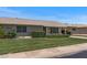 Charming single-story home with well-manicured lawn and covered carport, perfect for easy access at 19046 N Signal Butte Cir, Sun City, AZ 85373