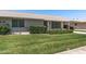 Inviting single-story home with lush green lawn and meticulous landscaping enhancing curb appeal at 19046 N Signal Butte Cir, Sun City, AZ 85373