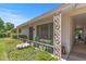 Welcoming front porch features charming railings, seating, and decorative details for relaxed outdoor living at 19046 N Signal Butte Cir, Sun City, AZ 85373
