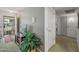 Hallway with neutral walls, indoor plants, and open doorways that invite exploration and comfort at 19046 N Signal Butte Cir, Sun City, AZ 85373