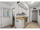 Functional kitchen features white appliances, ample storage, and an open layout leading to the dining area at 19046 N Signal Butte Cir, Sun City, AZ 85373