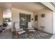 Covered patio with comfortable seating overlooking backyard at 19046 N Signal Butte Cir, Sun City, AZ 85373