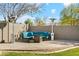 Comfortable outdoor patio area features cushioned seating, a fire pit, and standing heaters for relaxing evenings at 19305 E Oriole Way, Queen Creek, AZ 85142