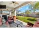 Inviting backyard with a covered patio, ample seating, and a well-maintained lawn, perfect for outdoor relaxation and entertainment at 19305 E Oriole Way, Queen Creek, AZ 85142