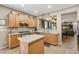 Well-equipped kitchen featuring ample cabinet space, a center island, and an open layout to the living area at 19305 E Oriole Way, Queen Creek, AZ 85142