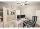 Home office area complete with desk, office chair, storage, and open access to the living area at 19305 E Oriole Way, Queen Creek, AZ 85142