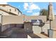 A spacious built-in outdoor kitchen with a BBQ, countertop, and seating offers a fantastic outdoor dining experience at 19305 E Oriole Way, Queen Creek, AZ 85142