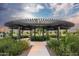 Relaxing community space with circular pergola, lush landscaping, and peaceful walkway for residents to enjoy at 1948 W Rowel Rd, Phoenix, AZ 85085