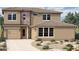 Attractive two-story home featuring a two-car garage, neutral stucco, and stone accents at 1948 W Rowel Rd, Phoenix, AZ 85085