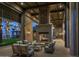 Inviting outdoor fireplace with comfortable seating, ideal for cozy evenings and social gatherings at 1948 W Rowel Rd, Phoenix, AZ 85085