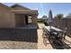 Fully landscaped backyard with a covered patio, perfect for outdoor relaxation and entertaining at 2132 W Gold Dust Ave, San Tan Valley, AZ 85144