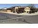 Charming single-story home with a well-manicured yard and neutral paint palette and an American flag at 2132 W Gold Dust Ave, San Tan Valley, AZ 85144