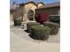Close up of yard featuring an American flag and colorful bushes that enhance the home's curb appeal at 2132 W Gold Dust Ave, San Tan Valley, AZ 85144