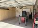 Open garage with custom built in cabinets, sealed concrete floor, work benches, and ample storage throughout at 2132 W Gold Dust Ave, San Tan Valley, AZ 85144