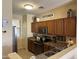Well-equipped kitchen with wood cabinets, stainless steel appliances, and ample counter space at 2132 W Gold Dust Ave, San Tan Valley, AZ 85144