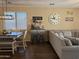 Inviting living room featuring a dining area, coffee bar, and cozy sectional sofa for relaxing at 2132 W Gold Dust Ave, San Tan Valley, AZ 85144