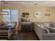 Inviting open concept living and dining area featuring a custom coffee bar and modern decor at 2132 W Gold Dust Ave, San Tan Valley, AZ 85144