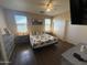 Comfortable bedroom featuring natural light, stylish furnishings, and spacious closet for ample storage at 2132 W Gold Dust Ave, San Tan Valley, AZ 85144