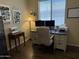 Comfortable office space with desk, chair, and plenty of natural light from a large window at 2132 W Gold Dust Ave, San Tan Valley, AZ 85144