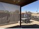 Outdoor patio featuring an adjustable sun shade with outdoor seating and a grill at 2132 W Gold Dust Ave, San Tan Valley, AZ 85144