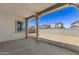 Covered back patio with decorative support beams offering views of the neighboring homes at 2149 W Rowel Rd, Phoenix, AZ 85085