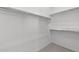 Walk in closet offering ample storage space with multiple shelves and rods at 2149 W Rowel Rd, Phoenix, AZ 85085