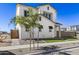 Inviting two-story home with a well-maintained lawn, stylish arched entrance, and modern white facade at 2149 W Rowel Rd, Phoenix, AZ 85085