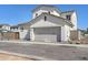Modern two-car garage featuring a neutral-toned door with clean lines, complementing the home's contemporary style at 2149 W Rowel Rd, Phoenix, AZ 85085