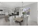 Bright, open kitchen features an island, gray cabinets, and sleek black countertops, perfect for modern living at 2149 W Rowel Rd, Phoenix, AZ 85085