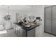 Open-concept kitchen with an island, modern appliances, and seamless integration with the living and dining spaces at 2149 W Rowel Rd, Phoenix, AZ 85085