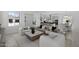 Bright and airy living room featuring stylish furnishings and an open floor plan connecting to the kitchen and dining area at 2149 W Rowel Rd, Phoenix, AZ 85085