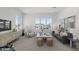 Bright living room with neutral colors, comfortable seating, and natural light at 2149 W Rowel Rd, Phoenix, AZ 85085