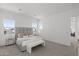 Beautifully staged Primary bedroom with neutral color palette and luxurious furnishings at 2149 W Rowel Rd, Phoenix, AZ 85085